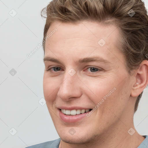 Joyful white young-adult female with short  brown hair and grey eyes