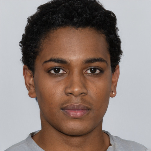 Neutral black young-adult female with short  brown hair and brown eyes