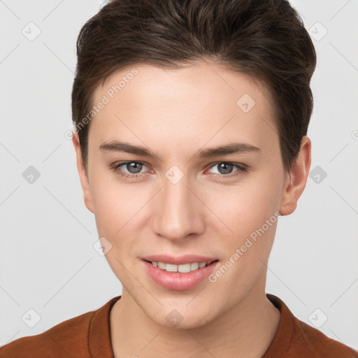 Joyful white young-adult female with short  brown hair and brown eyes