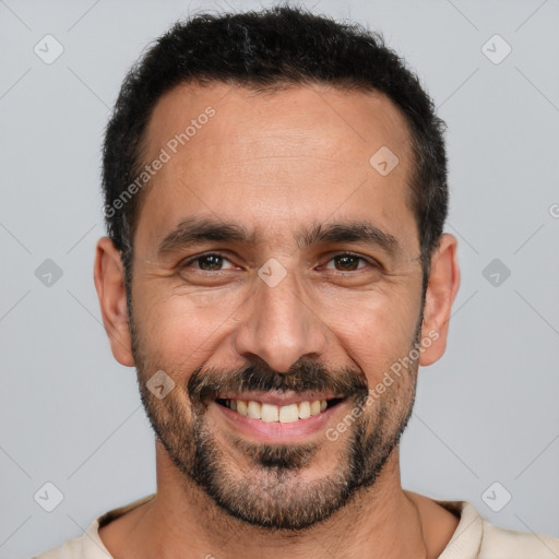 Joyful white adult male with short  black hair and brown eyes