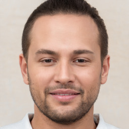 Joyful white young-adult male with short  brown hair and brown eyes