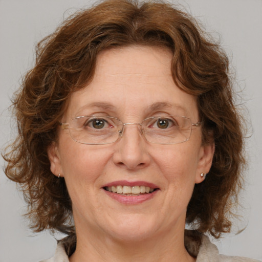 Joyful white middle-aged female with medium  brown hair and green eyes