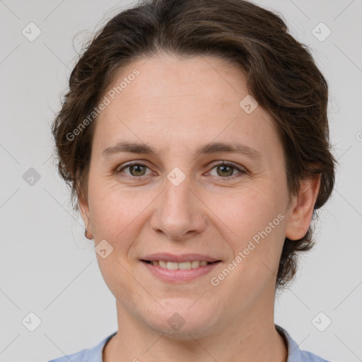 Joyful white adult female with short  brown hair and brown eyes