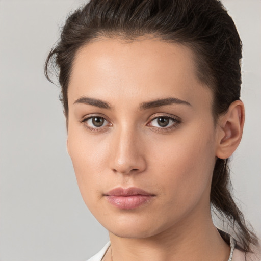 Neutral white young-adult female with medium  brown hair and brown eyes