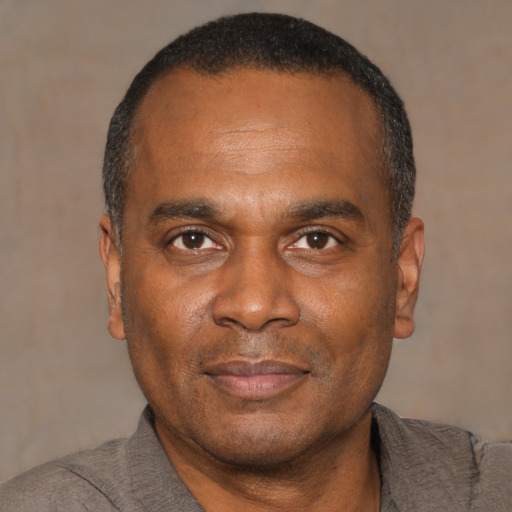 Neutral black adult male with short  black hair and brown eyes