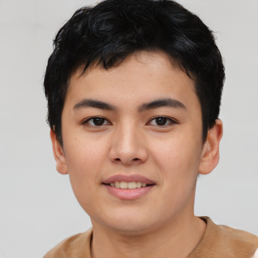 Joyful asian young-adult male with short  brown hair and brown eyes
