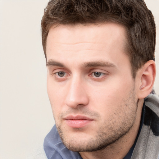 Neutral white young-adult male with short  brown hair and grey eyes