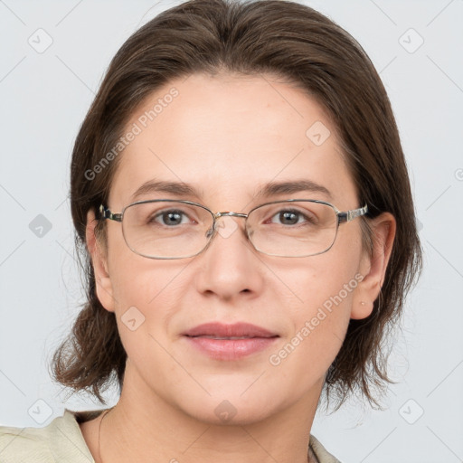 Joyful white adult female with medium  brown hair and grey eyes