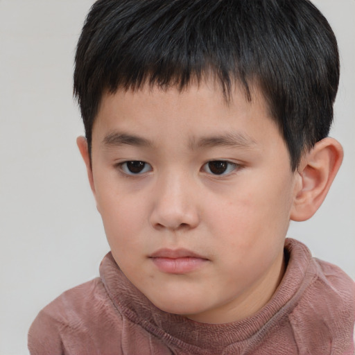 Neutral asian child male with short  brown hair and brown eyes