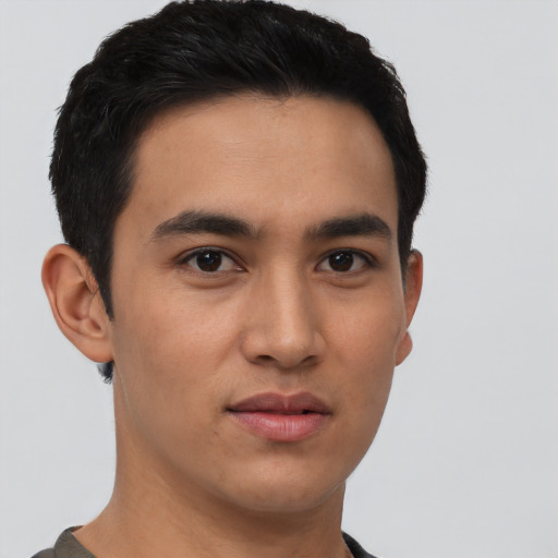 Neutral latino young-adult male with short  brown hair and brown eyes