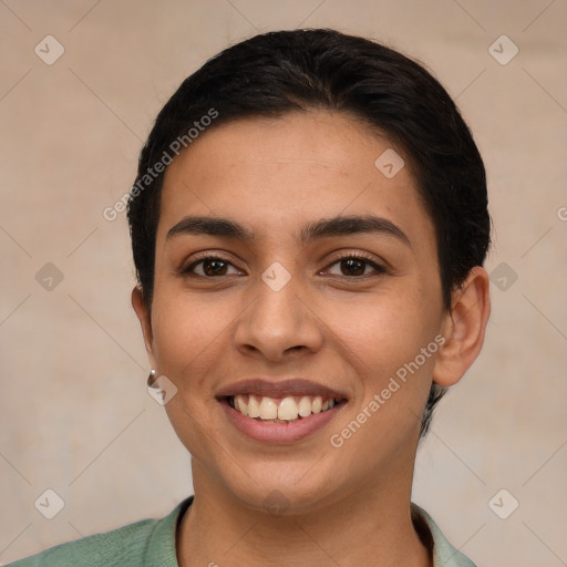 Joyful latino young-adult female with short  brown hair and brown eyes