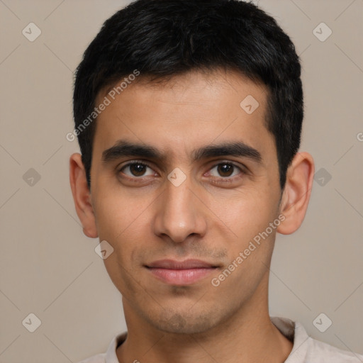 Joyful white young-adult male with short  black hair and brown eyes