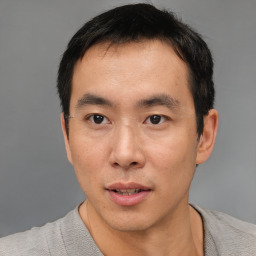 Neutral asian young-adult male with short  brown hair and brown eyes