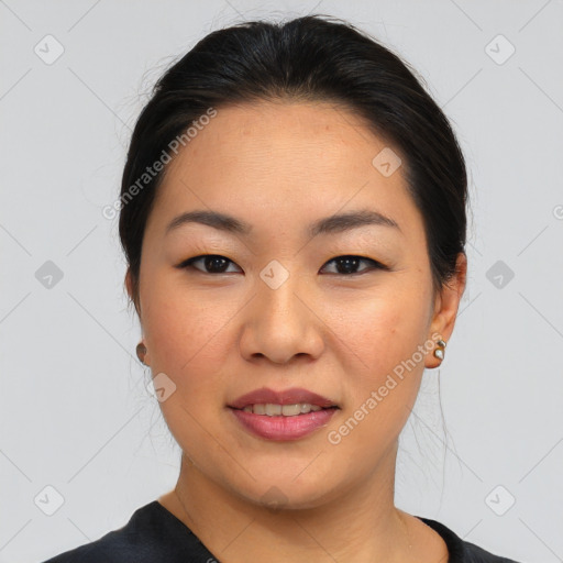 Joyful asian young-adult female with medium  black hair and brown eyes