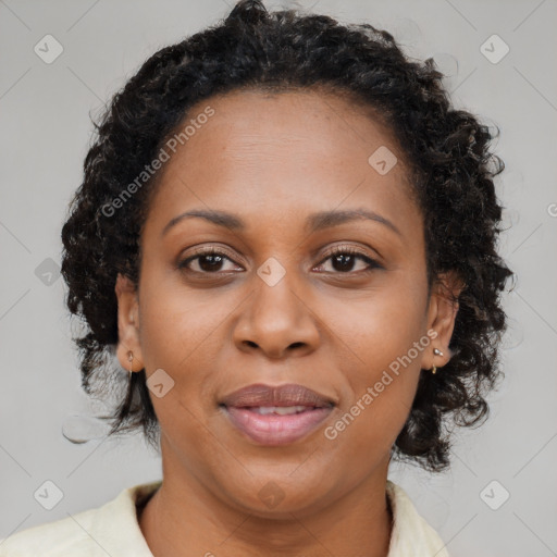 Joyful black adult female with medium  brown hair and brown eyes