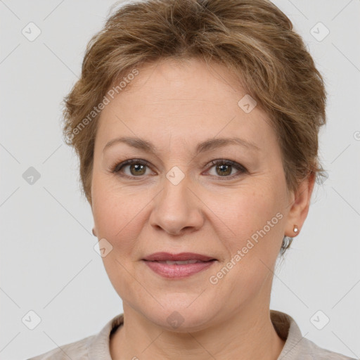 Joyful white adult female with short  brown hair and grey eyes