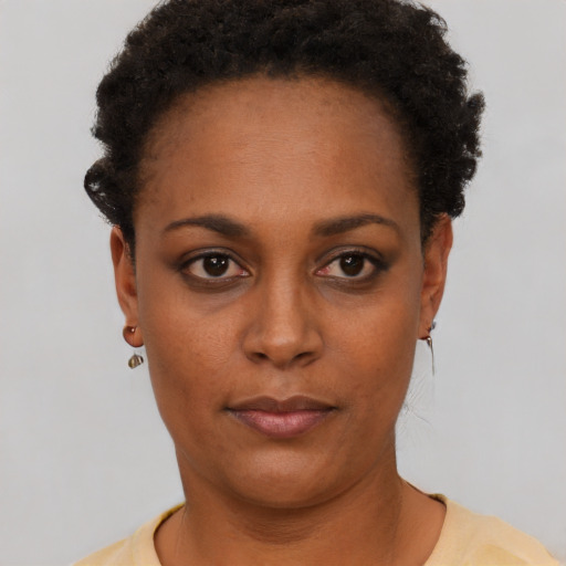 Neutral black young-adult female with short  black hair and brown eyes