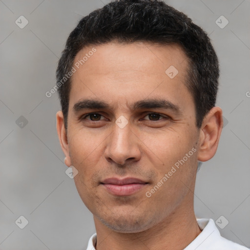 Joyful white young-adult male with short  black hair and brown eyes