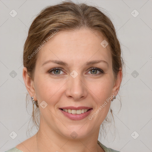 Joyful white adult female with medium  brown hair and green eyes