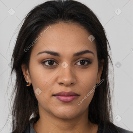 Joyful latino young-adult female with long  brown hair and brown eyes