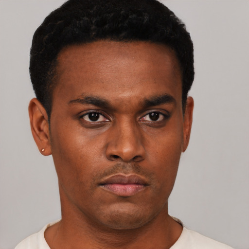 Neutral black young-adult male with short  black hair and brown eyes