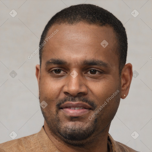 Joyful black young-adult male with short  black hair and brown eyes