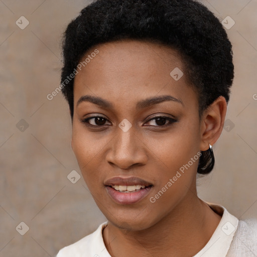 Joyful black young-adult female with short  black hair and brown eyes