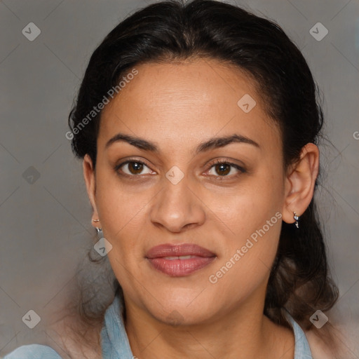 Joyful latino adult female with medium  brown hair and brown eyes