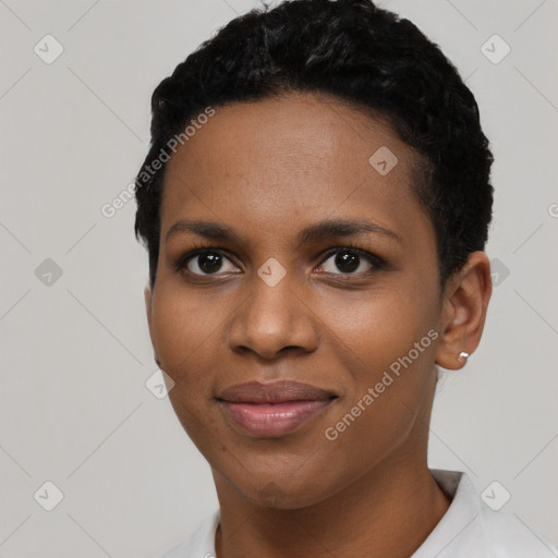 Joyful black young-adult female with short  black hair and brown eyes