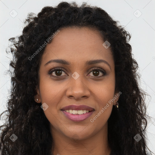 Joyful black young-adult female with long  brown hair and brown eyes