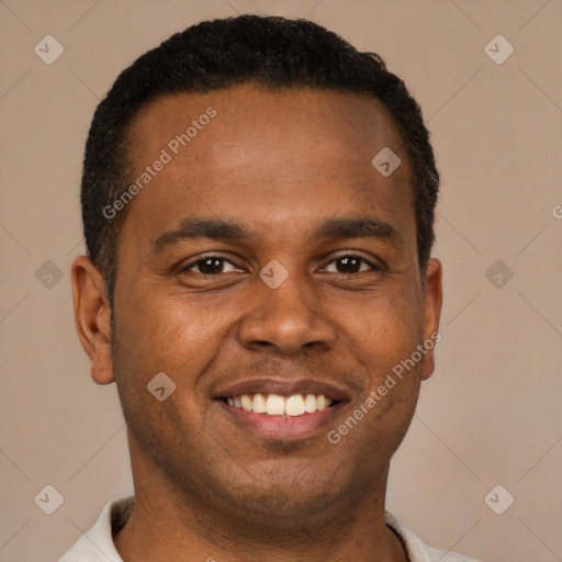 Joyful black young-adult male with short  brown hair and brown eyes