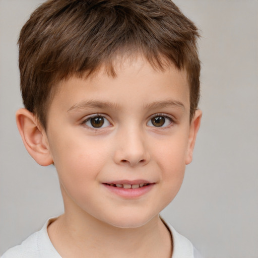 Joyful white child male with short  brown hair and brown eyes