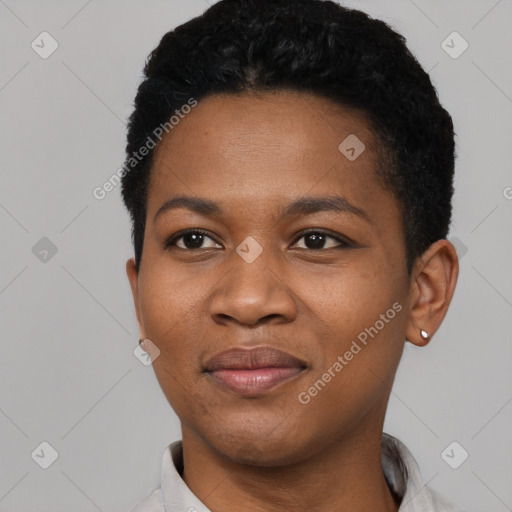 Joyful black young-adult female with short  black hair and brown eyes