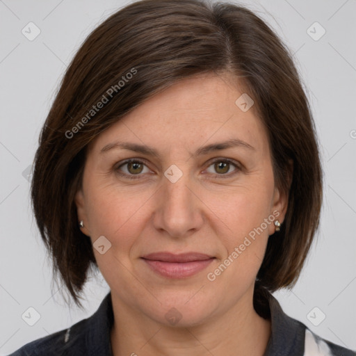 Joyful white adult female with medium  brown hair and grey eyes