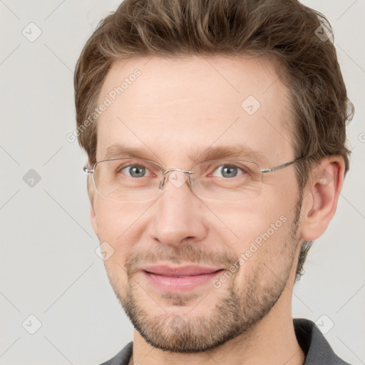 Joyful white adult male with short  brown hair and grey eyes