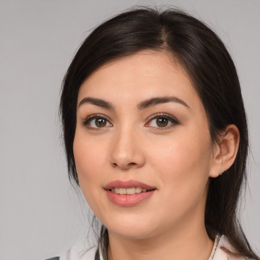 Joyful white young-adult female with medium  brown hair and brown eyes