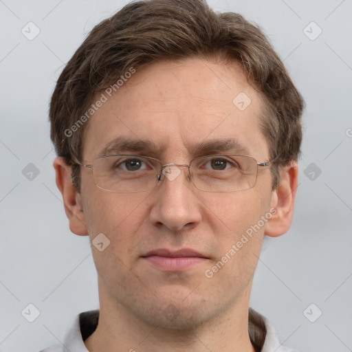 Joyful white adult male with short  brown hair and grey eyes