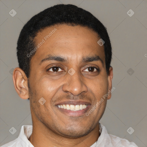 Joyful latino young-adult male with short  brown hair and brown eyes