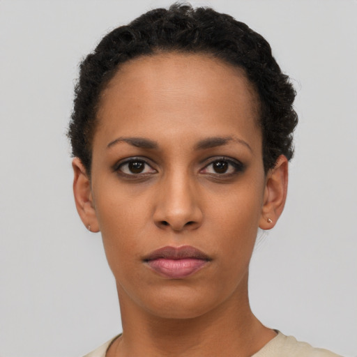 Neutral latino young-adult female with short  black hair and brown eyes