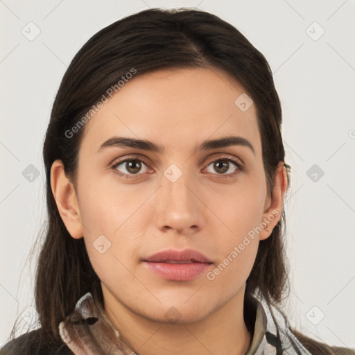 Neutral white young-adult female with long  brown hair and brown eyes