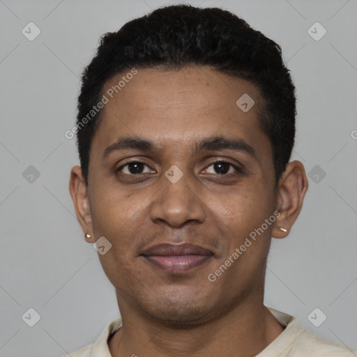 Joyful black young-adult male with short  black hair and brown eyes