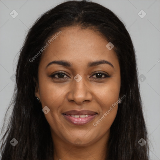 Joyful black young-adult female with long  brown hair and brown eyes