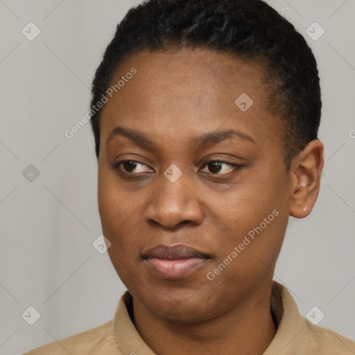 Joyful black young-adult female with short  black hair and brown eyes