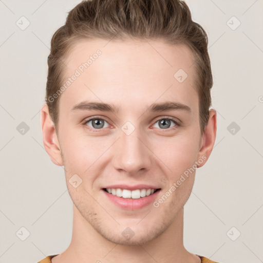 Joyful white young-adult male with short  brown hair and grey eyes