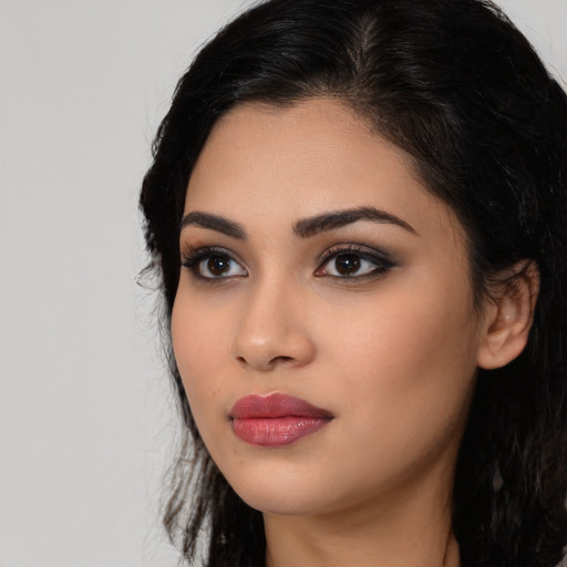 Neutral latino young-adult female with long  black hair and brown eyes