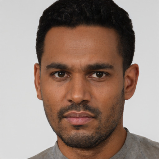 Neutral latino young-adult male with short  black hair and brown eyes