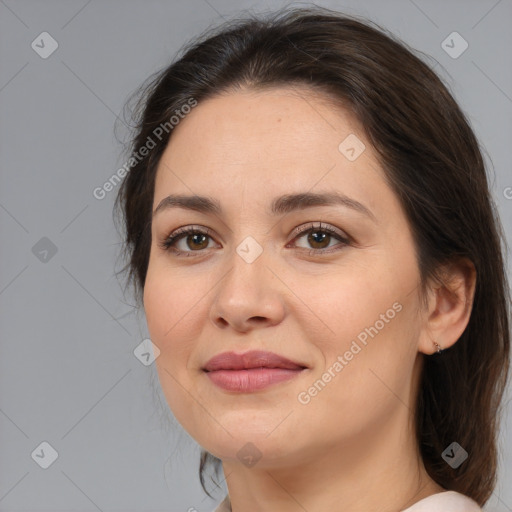 Joyful white young-adult female with medium  brown hair and brown eyes