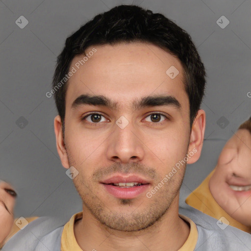 Joyful white young-adult male with short  black hair and brown eyes