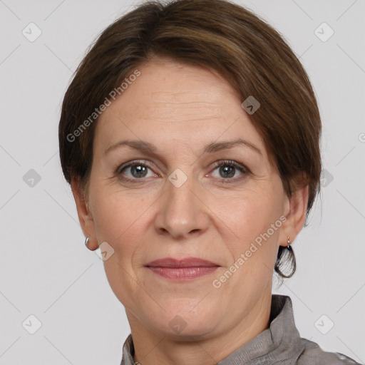 Joyful white adult female with short  brown hair and grey eyes