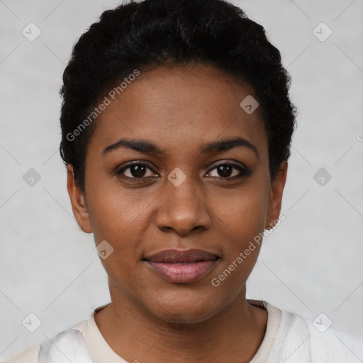 Joyful black young-adult female with short  black hair and brown eyes